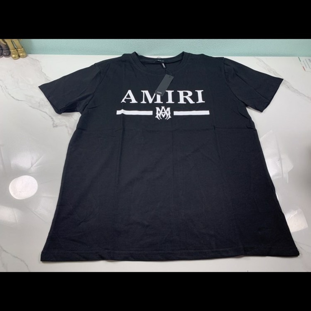 T-shirt from AMIRI featuring black/white, cotton, logo print. Fits like a Large